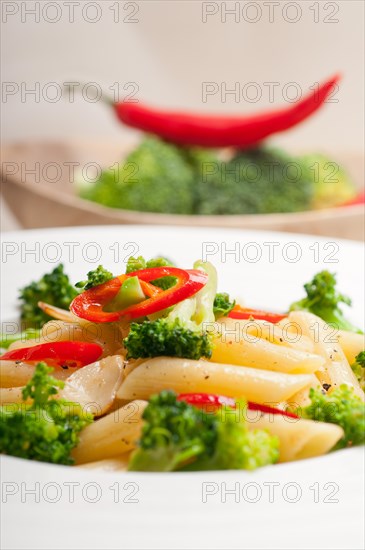 Classic Italian penne pasta with broccoli and red chili pepper