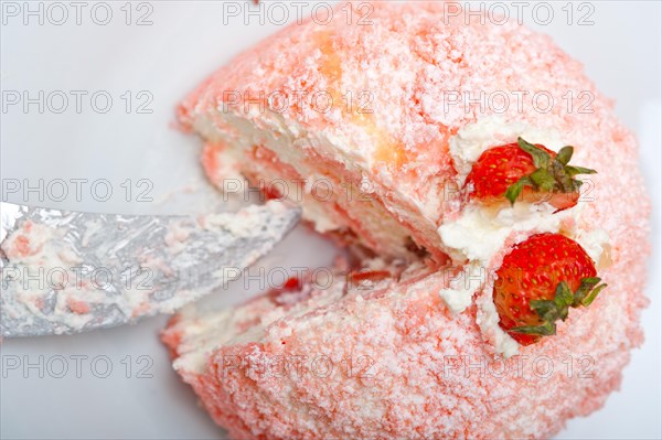 Fresh pink strawberry and whipped cream dessert macro close up