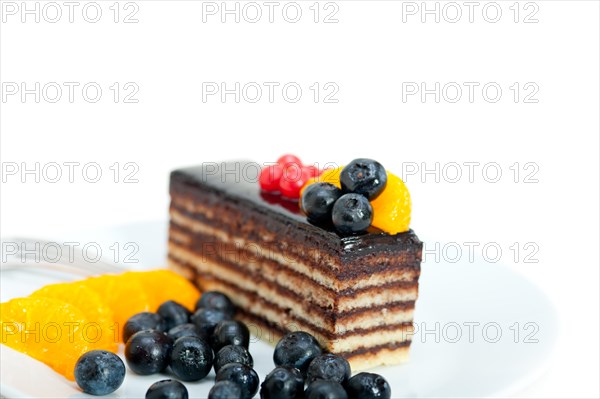 Chocolate cake and fresh fruit on top closeup macro