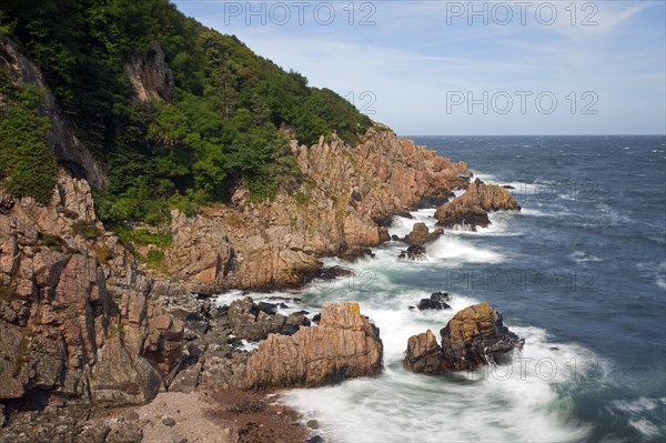 Rocks on the beach and cliffs along the rocky coast at the nature reserve Josefinelust