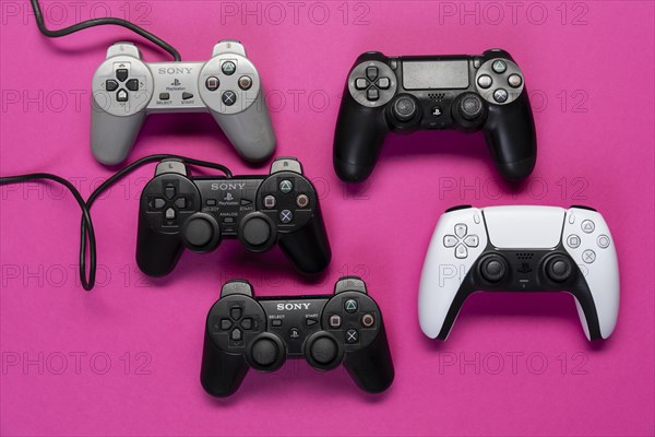 Different generations of game controllers of the Playstation game console