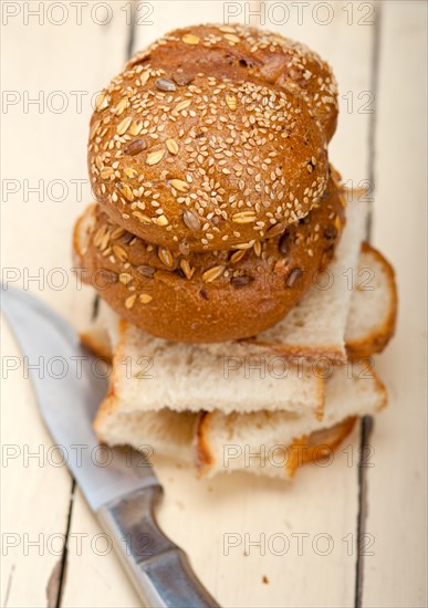 Fresh organic bread over rustic table macro closeup