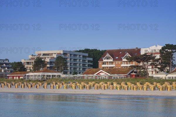 Roofed wicker beach chairs along the Baltic Sea at Scharbeutz