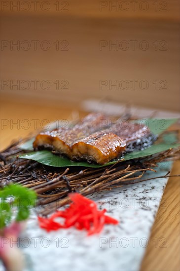 Japanese style roasted eel served on palm leaf