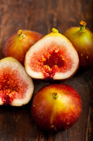 Fresh figs macro closeup over old wood boards