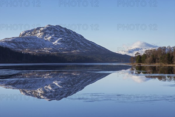 Loch Laggan and snow covered mountain Creag Meagaidh near Dalwhinnie in the Scottish Highlands in winter