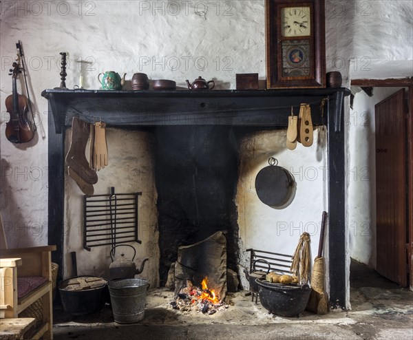 Peat fire burning in fireplace at the Croft House Museum