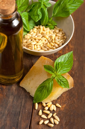 Italian basil pesto ingredients over old wood macro