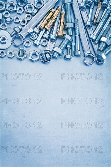 Large set of stainless steel repair tools on metallic background copyspace image construction concept