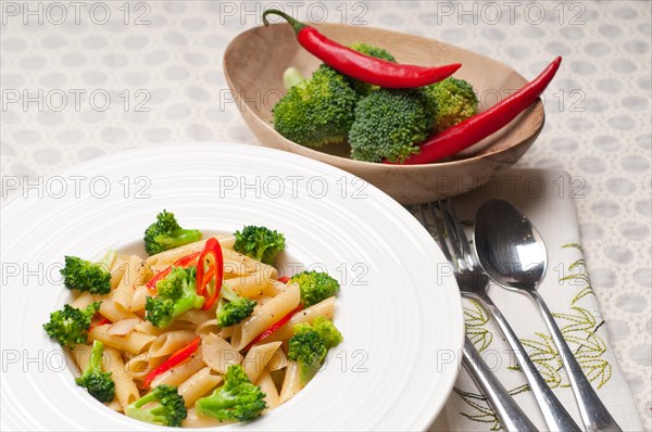 Classic Italian penne pasta with broccoli and red chili pepper