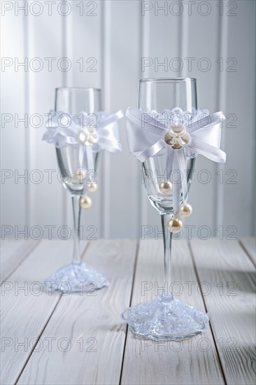Two wedding ornated empty wineglassess