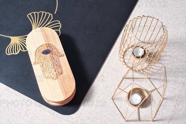 Image of a box with nails in a light studio on a black mat. Yoga concept. Spiritual practices. Mixed media