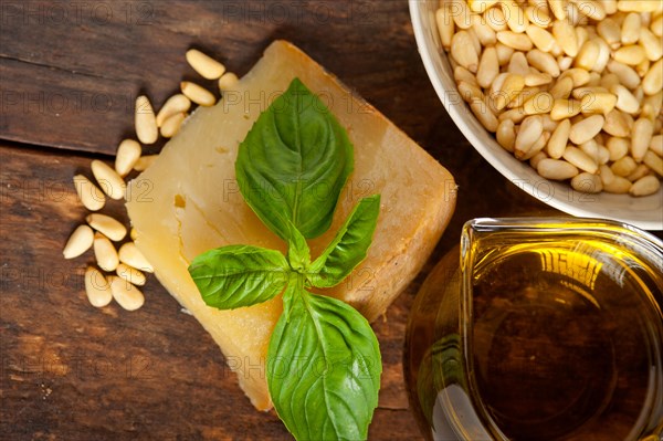 Italian basil pesto ingredients over old wood macro