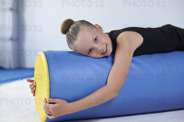 Image of a little girl in the gym. Gymnastics concept. Mixed media