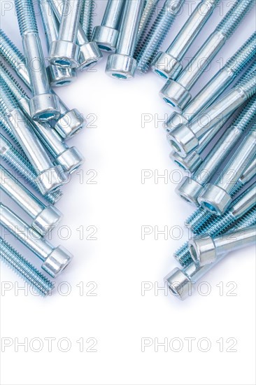 Industrial background long bolts against a white background