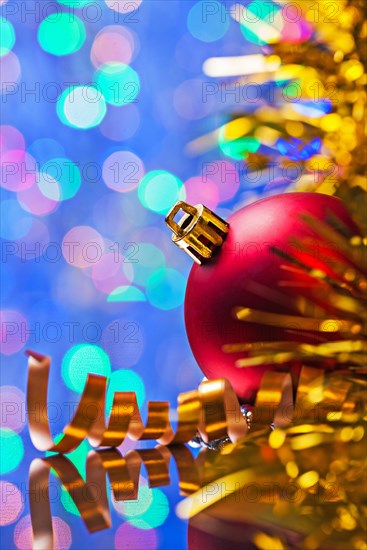 Copyspace image Christmas background red ball and tinsel on bokeh