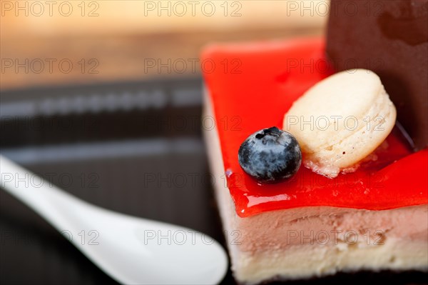 Fresh strawberry yogurt mousse with macaroon and blueberry on top