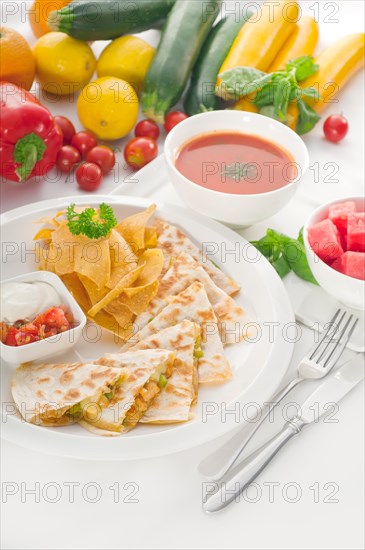 Original Mexican quesadilla de pollo with nachos served with gazpacho soup and watermelon