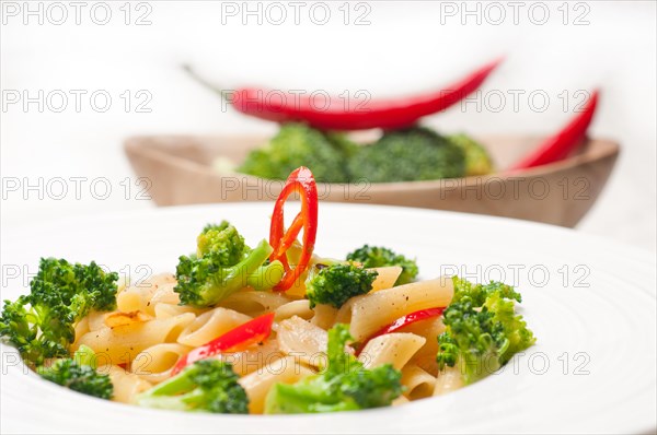 Classic Italian penne pasta with broccoli and red chili pepper