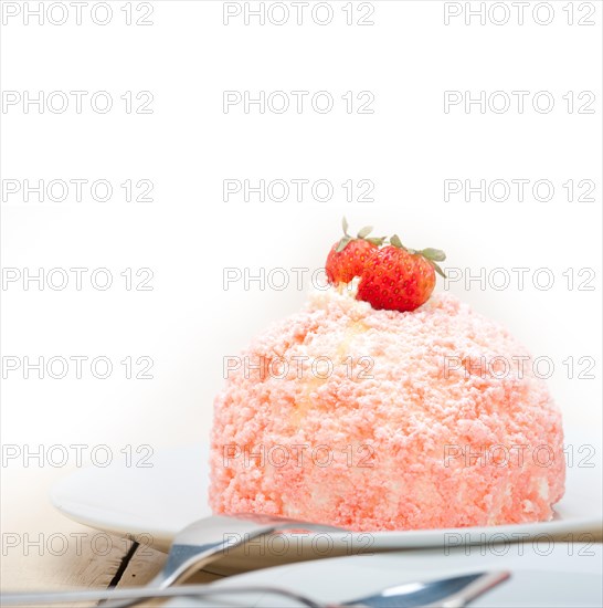 Fresh pink strawberry and whipped cream dessert macro close up