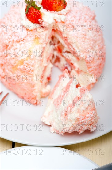 Fresh pink strawberry and whipped cream dessert macro close up