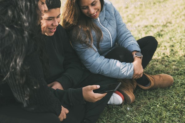 Hispanic family spending quality time together in a local park on a beautiful