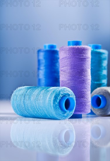 Five sewing bobbins