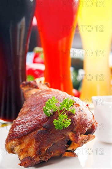 Original German BBQ pork knuckle served with mashed potatoes and sauerkraut