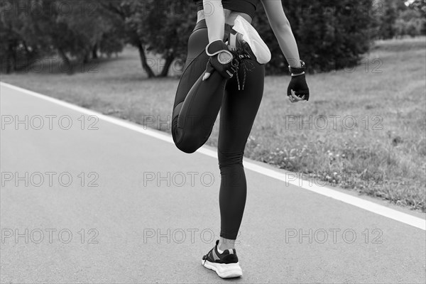 Image of a girl in the park doing a workout. The concept of a healthy lifestyle. Mixed media