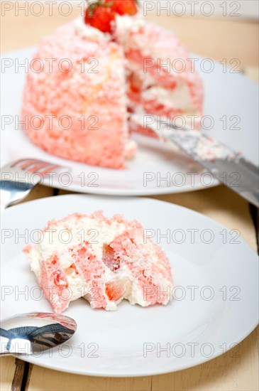 Fresh pink strawberry and whipped cream dessert macro close up