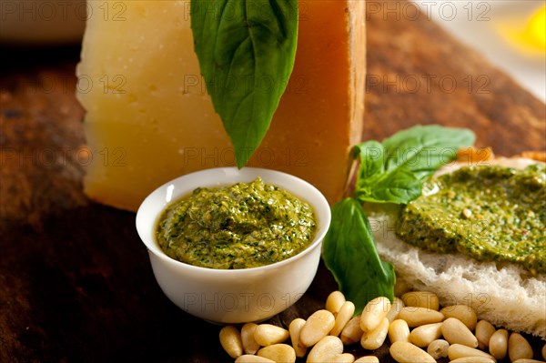 Italian basil pesto bruschetta ingredients over old wood macro