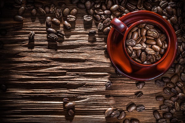 Coffee beans bowl on vintage wooden board