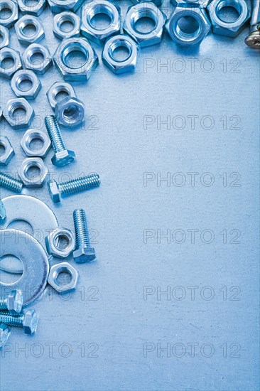 Metallic background with stainless steel bolts