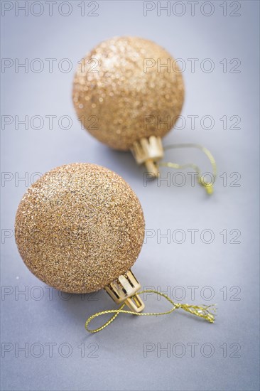 Golden christmas balls on grey background