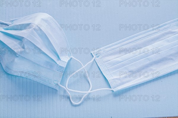 Medical concept Disposable face masks on a blue background