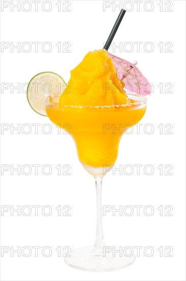 Frozen mango margarita daiquiri with lime black straw and pink umbrella isolated on white background