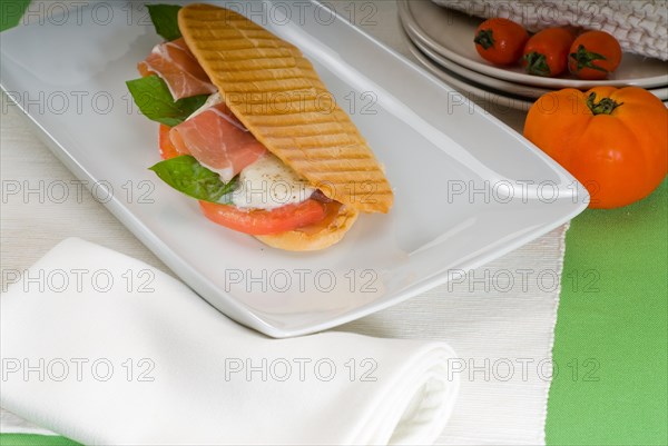 Panini sandwich with fresh caprese and parma ham