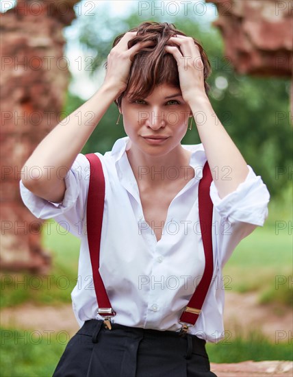 Image of a stylish beautiful woman in a white shirt