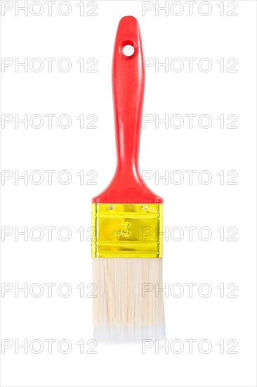A brush with a red handle