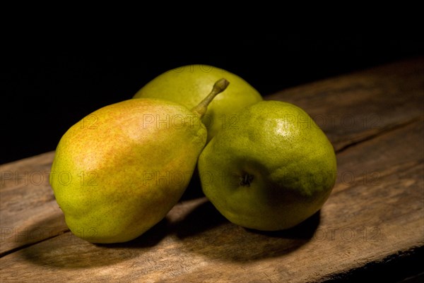 Autumn fresh pears over old wood board