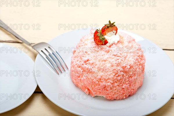 Fresh pink strawberry and whipped cream dessert macro close up