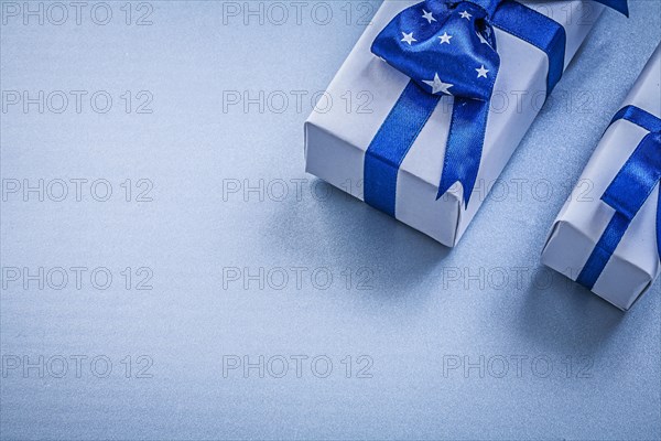 Assortment of gift boxes on blue background holidays concept