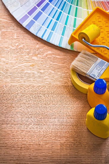 Home improvement colour tools and pantone fan on wooden board maintenance concept