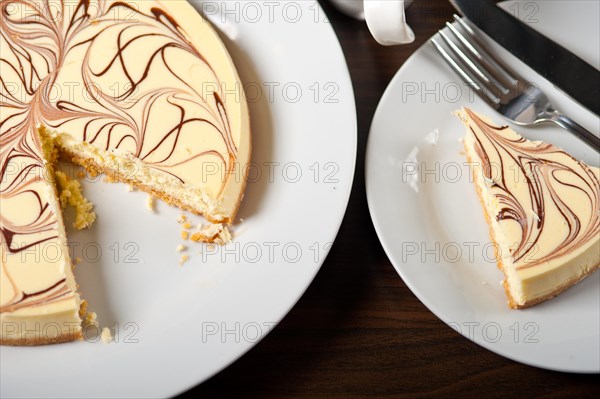 Fresh baked classic Cheese cake with chocolate topping and espresso coffee