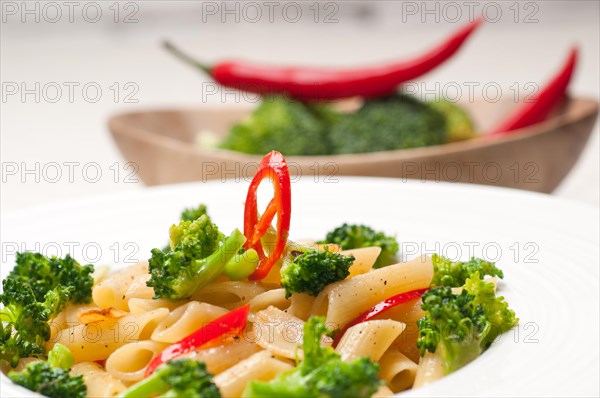 Classic Italian penne pasta with broccoli and red chili pepper