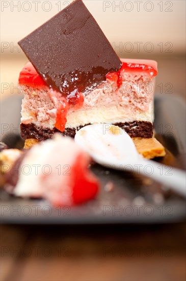 Fresh strawberry yogurt mousse with macaroon and blueberry on top