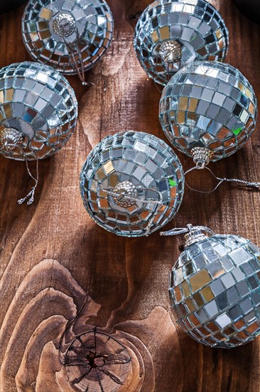 Christmas disco balls on an old wooden background