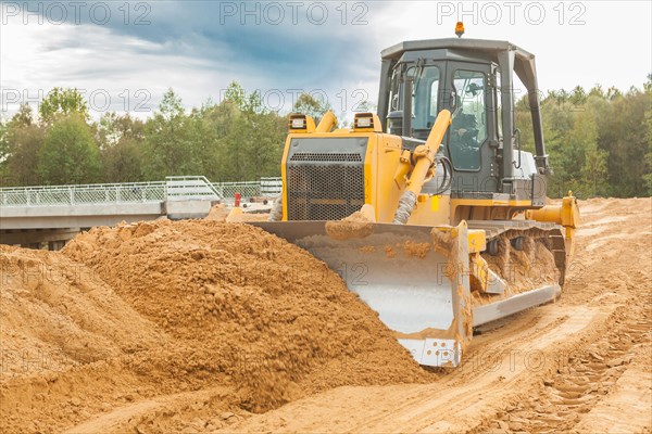 Bulldozer moves sand