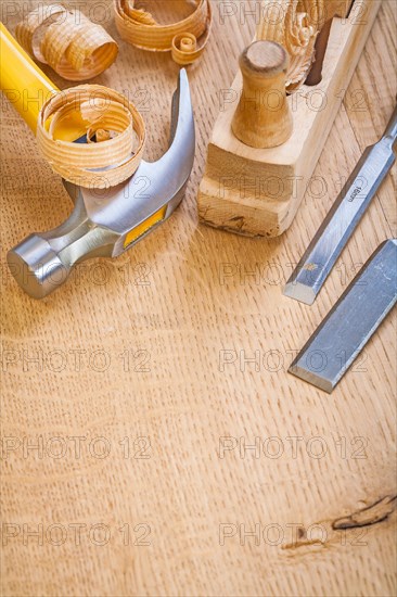 Chisel hammer Joiner's plane on wooden board