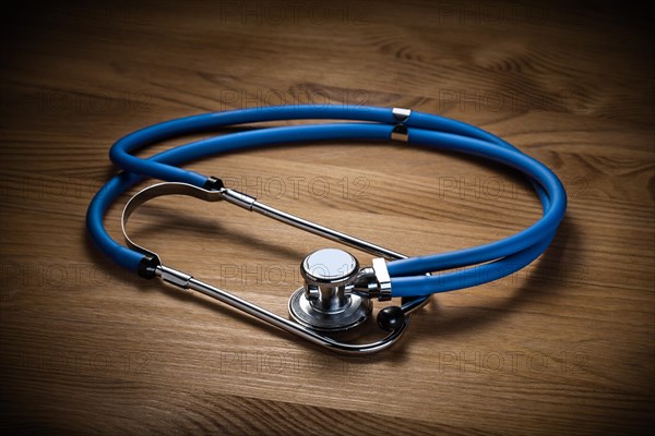 Classic medical tool Stethoscope on wooden board